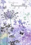 This sympathy card unfolds like a gentle visual poem, the kind of quiet scene you might imagine along a peaceful lane near Emerson Park at dusk. Airy silhouettes of wildflowers stretch upward, each fine stem carrying a delicate umbel rendered in graceful shades of lavender, indigo, and soft blue. The flowers seem almost weightless, their intricate, lace-like forms catching an invisible light and suggesting the outline of a tranquil meadow. Pale petals and subtle impressions of foliage drift across the background, laid over a misty wash of purples and soft green-greys. The effect is dreamlike, as if the flowers and leaves are floating in slow motion through softened evening air above Hornchurch's rooftops. Here and there, butterflies hover near the blooms, their wings translucent and barely touched with colour. They evoke gentle transformation and the feeling of a loved one's presence lingering tenderly nearby. The palette is cool yet comforting, with no jarring tones-only harmonies of violet, blue, and grey that soothe the eye and calm the spirit. In elegant script, the message With Sincere Sympathy appears above or within the floral design, its flowing letters knitted seamlessly into the artwork. At Florist Hornchurch, we often see how such thoughtful, understated designs help families express what words alone cannot. This card feels like a respectful embrace, wrapped in nature's reassurance, perfectly suited to accompany sympathy flowers delivered to homes around Hornchurch, Elm Park, or Upminster when you wish to offer quiet, heartfelt condolences.