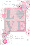 In this image, a romantic anniversary card is shown with a design that blends soft pastel pinks, silvery greys, and creamy whites, creating a sense of treasured intimacy similar to a peaceful evening in Hornchurch. The focal point is the word LOVE, set in raised, glitter-kissed letters, with the shapes forming a subtle, heart-like balance at the centre. The glitter is fine and smooth, catching light in a gentle shimmer rather than a harsh sparkle, much like morning light on petals in a garden near Harrow Lodge Park. Surrounding this centrepiece, clusters of stylised flowers open in soft blush and muted mauve, their outlines and inner shading rendered with a painterly delicacy that recalls watercolour petals. Slender vines and swirling stems weave between the flowers, giving the design a sense of movement similar to stems being arranged by hand in a Florist Hornchurch bouquet destined for a local anniversary delivery. Small details-floating petals, curling flourishes, and tiny, almost secret butterfly shapes-add layers of charm, encouraging a slow, appreciative gaze. The background is a smooth gradient of pastel pink and pale grey, with areas of light and shadow that lend depth and quiet drama. Elegant script phrases, including On Our Anniversary and I love you today and always, are placed carefully around the floral design, their flowing letters adding a personal, handwritten feel. Altogether, the card looks like a keepsake meant to be paired with a vase of fresh roses and seasonal blooms, a gentle but deeply heartfelt way to honour shared years in and around Hornchurch.